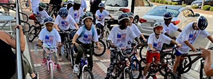 Kids from Boys and Girls Club riding bikes